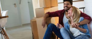 Couple with boxes in new home - Strong Home Mortgage